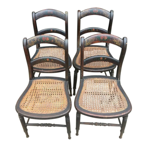 Antique wooden dining chairs with cane seats