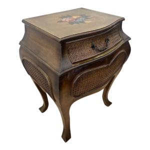Brown wood nightstand with carved flower details