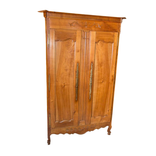 Classic French style wooden armoire with carved details