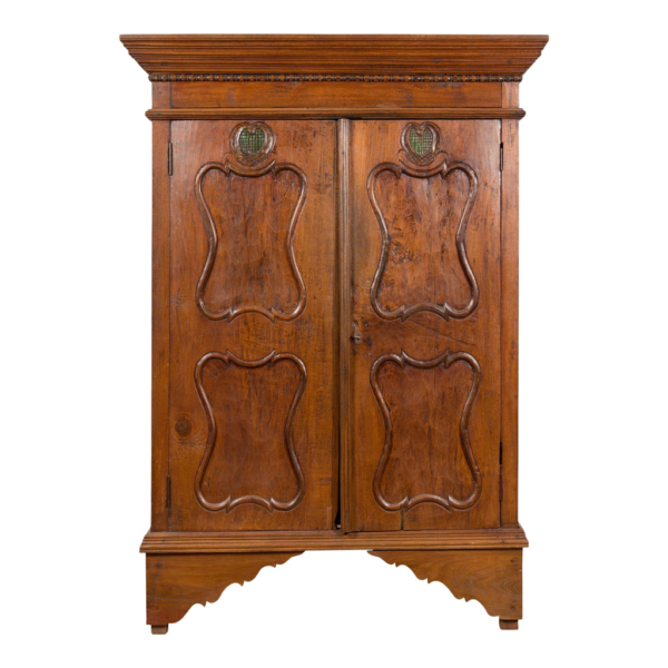 Classic brown wood armoire with carved doors