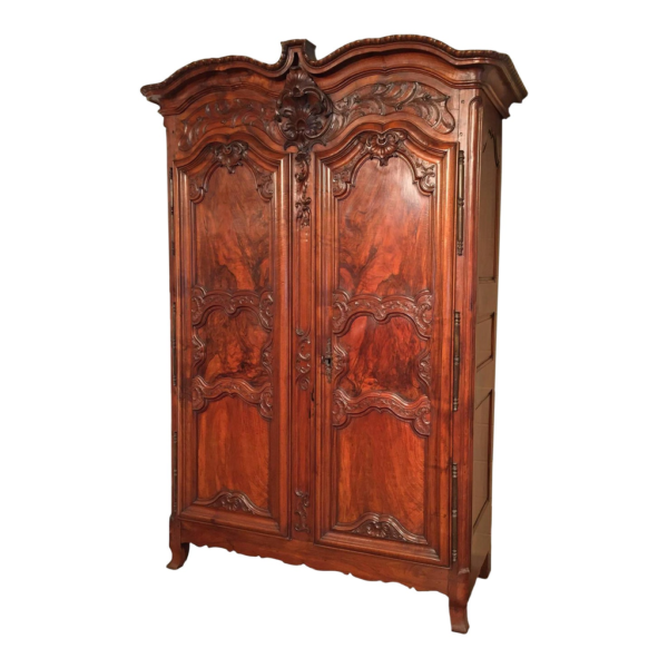Brown wood wardrobe with classic carvings