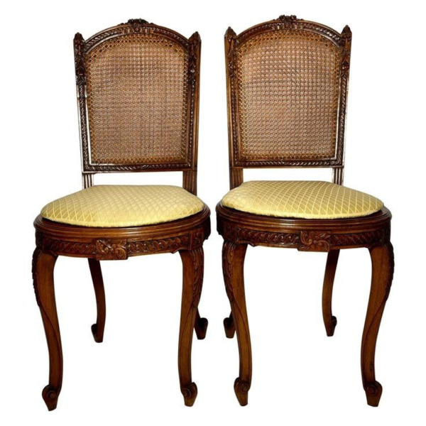 Classic dining chair with woven back and yellow cushion
