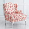 Elegant coral print wingback sofa