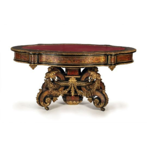 Antique Baroque style dining table with red faux leather top and ornate carvings