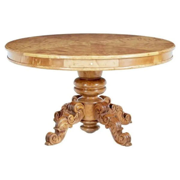 Victorian style round wood dining table with carved legs