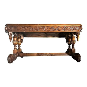 Renaissance style wood dining table with ornate carvings