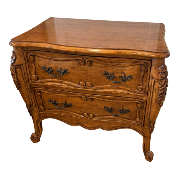 French Provincial style nightstand with brown wood and detailed carvings