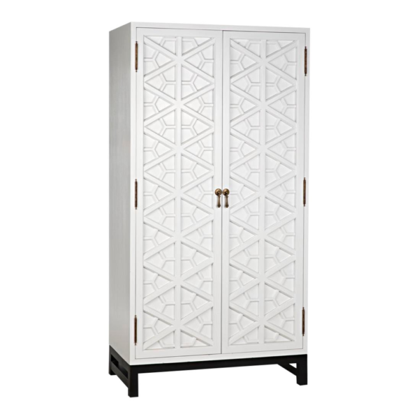 White wooden armoire with geometric carved doors.