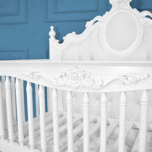 Handcarved from solid mahogany wood, this French-inspired baby cot combines timeless elegance with modern practicality. Featuring a plush white velvet tufted headboard, intricate floral carvings, and built-in storage drawers, it ensures durability, safety, and luxury for your nursery. The multifunctional design serves as both a crib and day bed, offering adjustability and mobility for babies