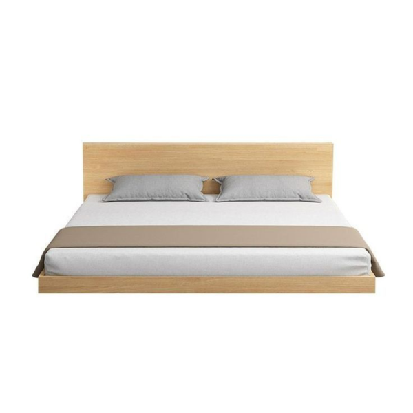 Mid-Century Modern wooden bed frame with grey pillows
