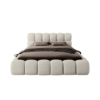 Modern beige upholstered platform bed.