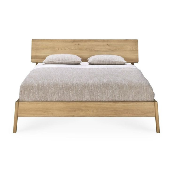 Modern minimalist bed in natural wood finish