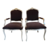 Pair of French Provincial dining chairs with brown upholstery and white wood frame.