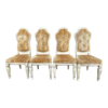 Set of 4 Mid-Century Modern dining chairs in white and gold striped fabric.