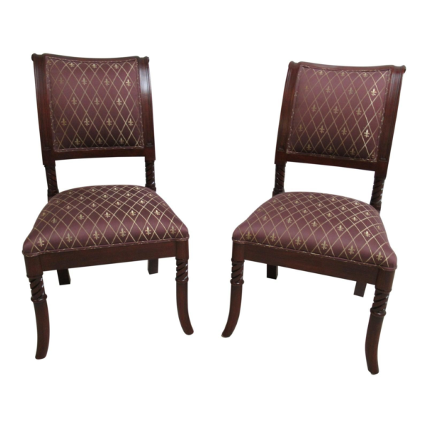 Set of two Regency Era dining chairs with burgundy and gold upholstered seats.