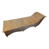 Luxury rattan chaise lounge, woven outdoor lounger, handcrafted patio furniture, designer rattan sunbed.
