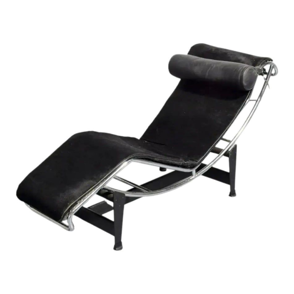 Black leather chaise lounge, modern steel frame, mid-century design, luxury seating
