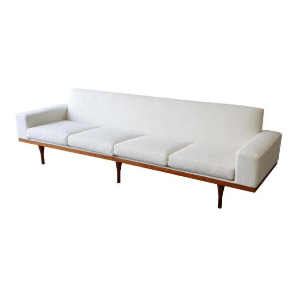 White boucle sofa, mid-century modern furniture, wood frame sofa, four-seater sofa, living room seating, designer sofa.