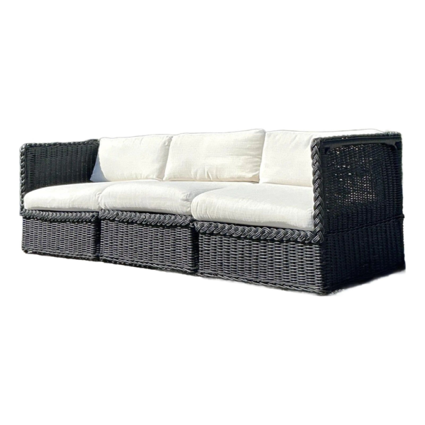 Black wicker sofa, outdoor patio furniture, cream cushions, garden seating, durable wicker construction, contemporary design.