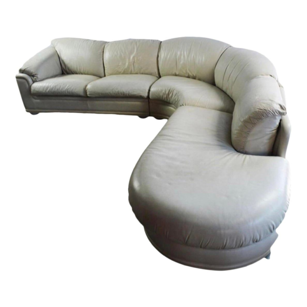 Cream leather sectional sofa, modern L-shaped couch, luxury living room furniture, comfortable seating arrangement, sectional sofa with wood frame.