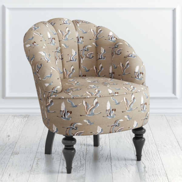 Beige accent chair with bird print fabric