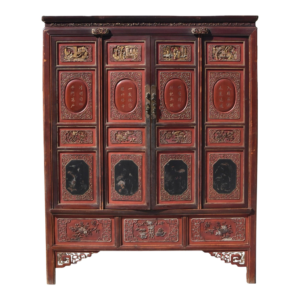 Red wooden armoire with carvings and Chinese inscriptions