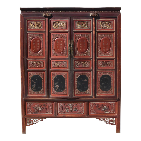 Red wooden armoire with carvings and Chinese inscriptions