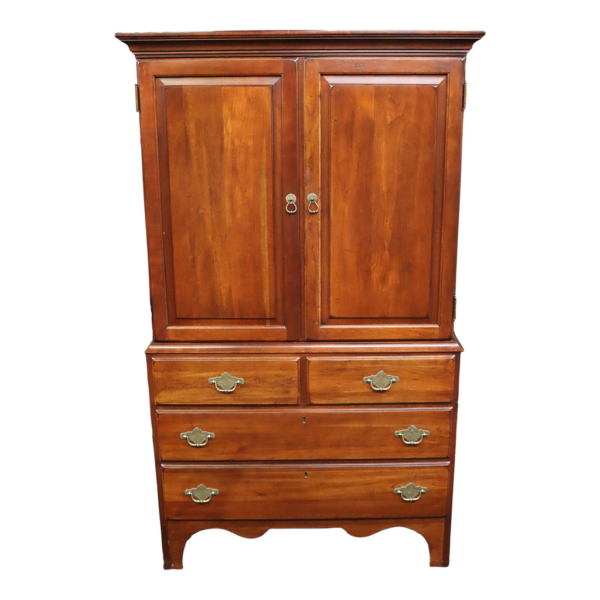 Classic wooden armoire with storage drawers