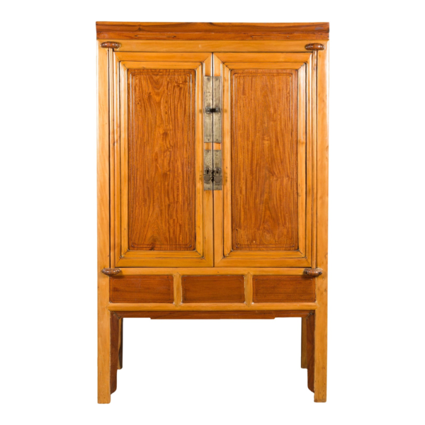Brown wooden armoire with two doors and three drawers