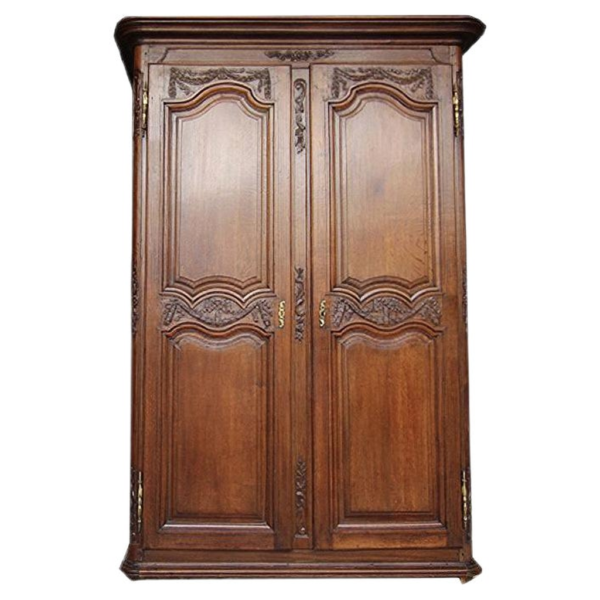 Classic brown wood armoire with intricate carvings