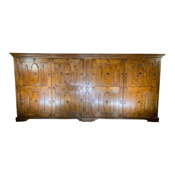 Classic brown wood wardrobe with carved detailing