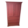 Red wooden armoire with drawers and wardrobe space