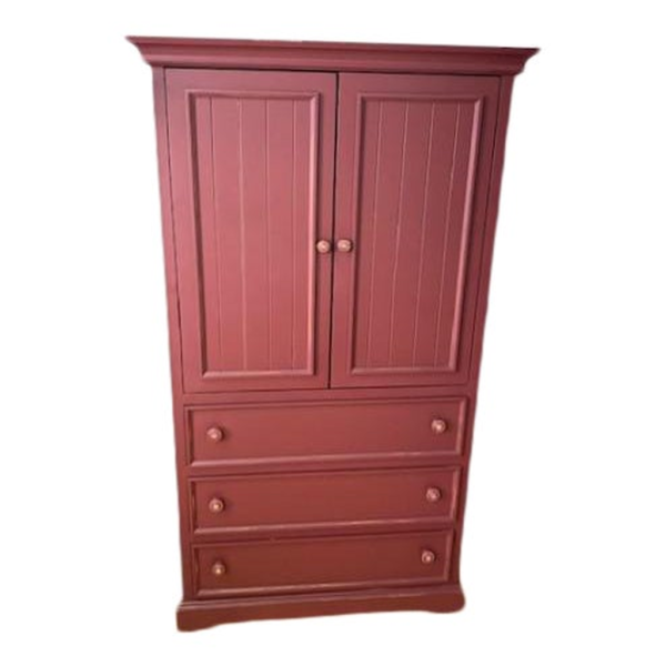 Red wooden armoire with drawers and wardrobe space