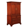 Classic reddish-brown wood wardrobe with drawers and ample storage.