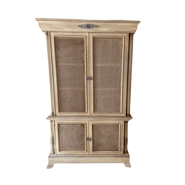Beige wood armoire with cane panel doors