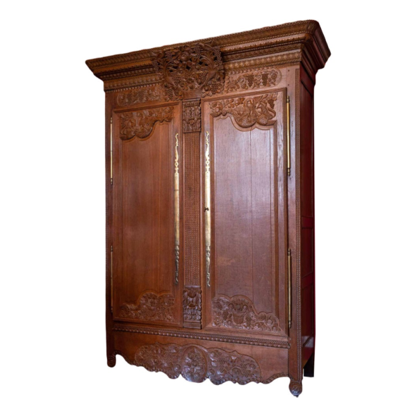 Classic brown wood armoire with intricate carvings.