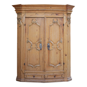 Classic light brown wooden armoire with intricate carving