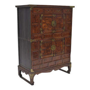 Classic brown wooden armoire with brass accents