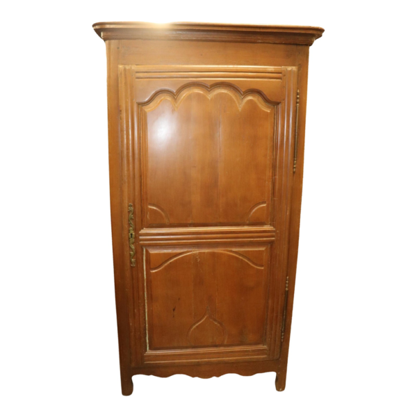 Classic wooden armoire with ornate details