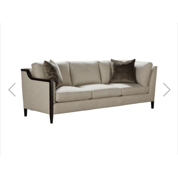 Beige sofa with plush cushions