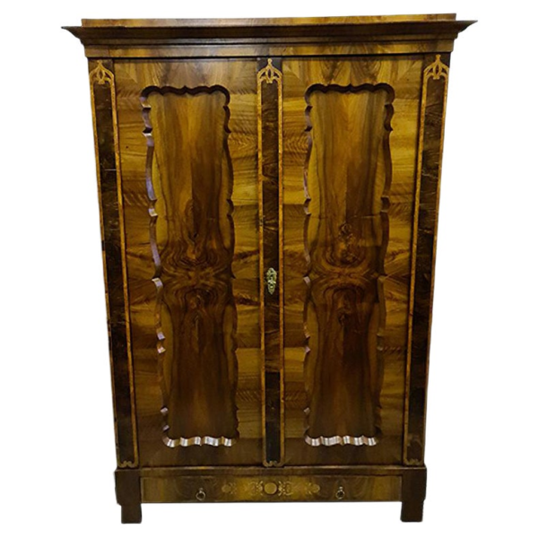Classic brown wood wardrobe with carved details