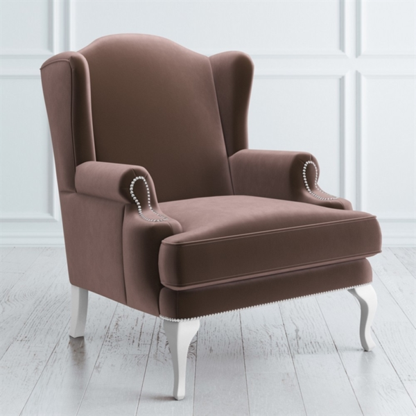 Brown wingback sofa with white wood legs and plush fabric upholstery