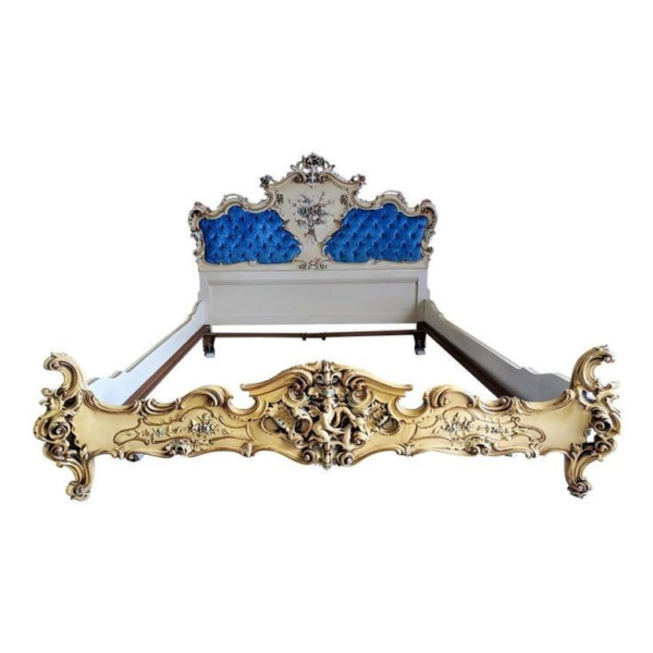 Victorian style carved bed with gold and blue velvet upholstery