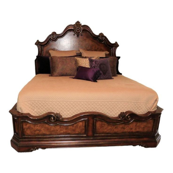 Victorian style wood bed with brown finish and ornate carvings
