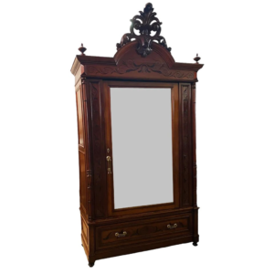 Vintage brown wood armoire with carved details