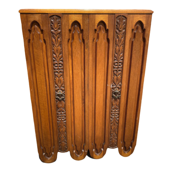 Vintage armoire with carved floral accents