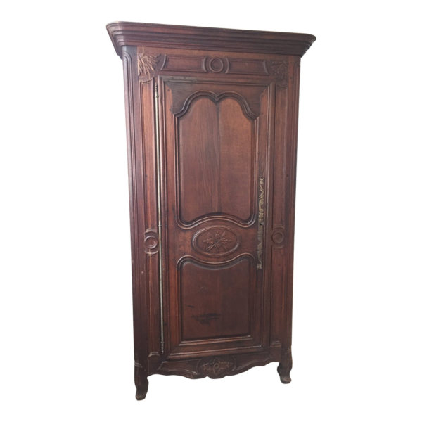 Classic brown wood armoire with intricate carvings
