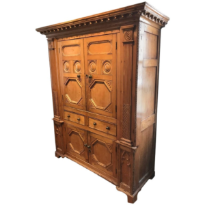 Vintage brown wooden armoire with intricate carvings