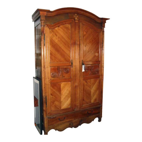 Vintage brown wood armoire with carved details