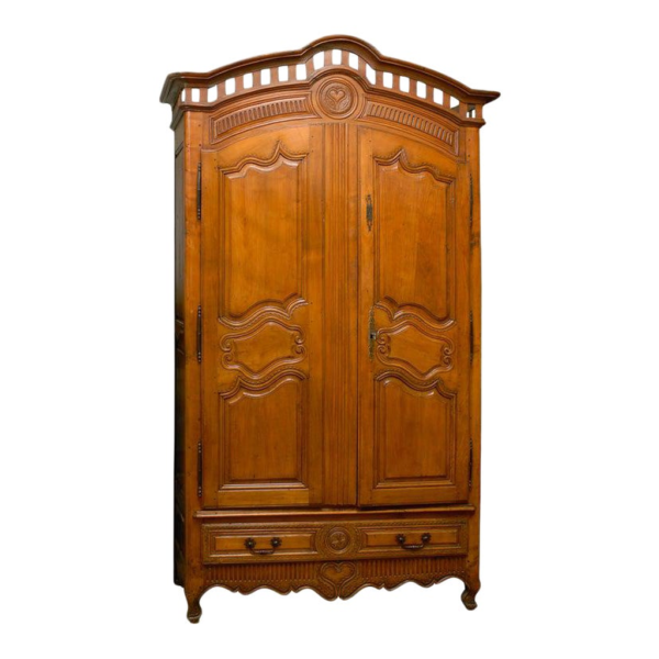 Vintage wooden armoire with carved detailing